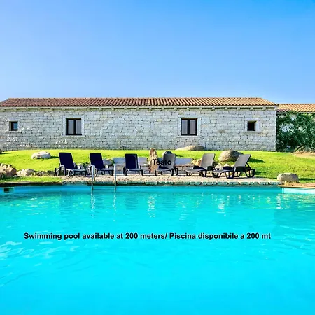 Isa - With Common Swimming-pool And Outdoor Private Area In Badesi